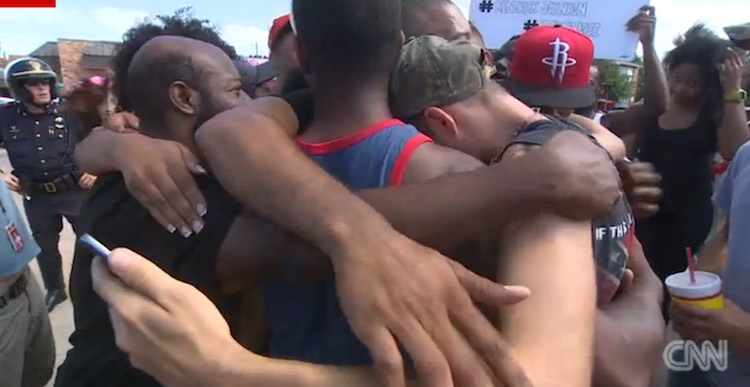 Texas-protestors-group-hug-CNNvideo